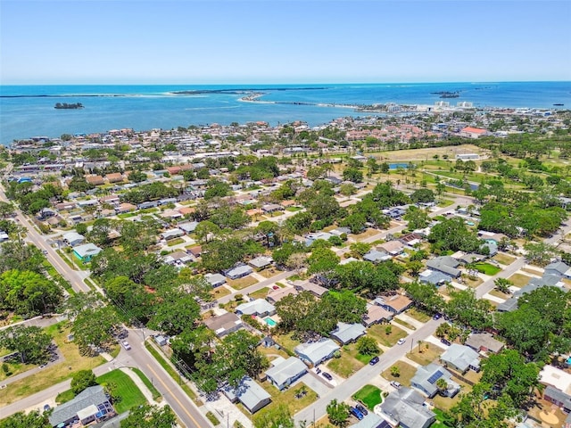 aerial view of property's location with a nearby body of water