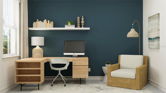 office with baseboards and built in desk