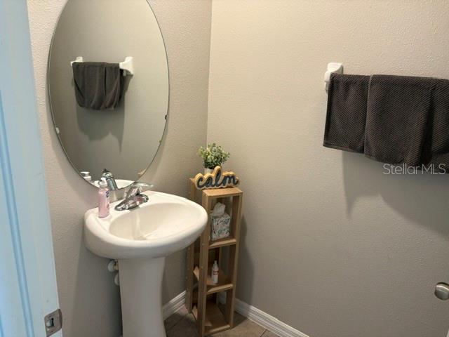 bathroom with baseboards