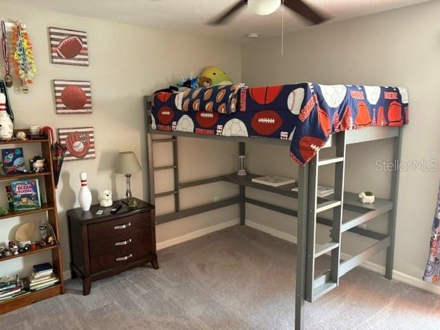 bedroom featuring baseboards, carpet flooring, and ceiling fan