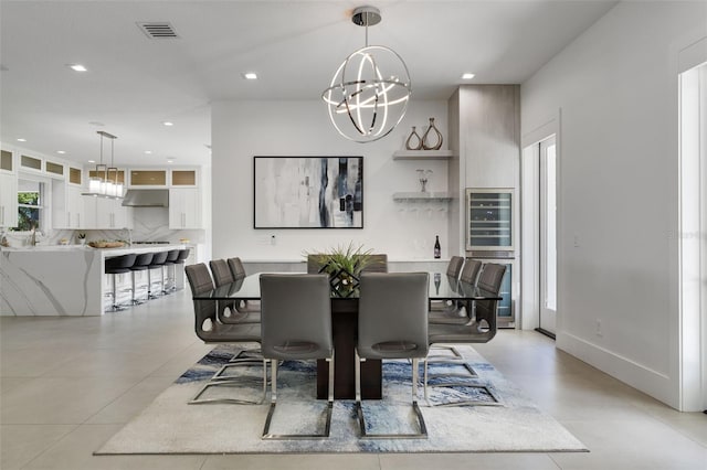 5500 W Lake Butler Rd, Windermere, FL 34786 - dining space featuring a chandelier, beverage cooler, and recessed lighting