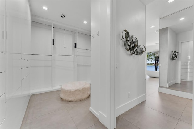 5500 W Lake Butler Rd, Windermere, FL 34786 - hallway with light tile patterned flooring, baseboards, and recessed lighting