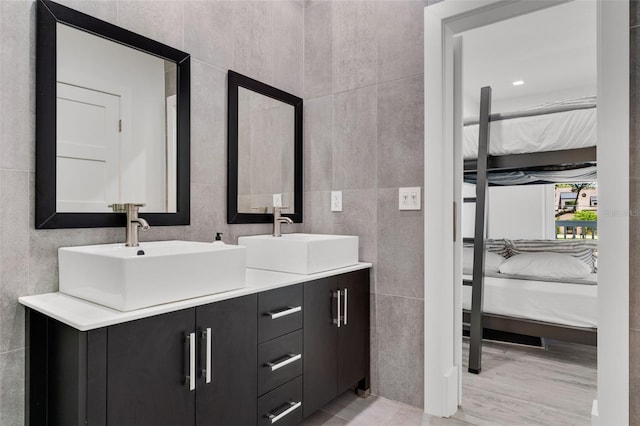 5500 W Lake Butler Rd, Windermere, FL 34786 - ensuite bathroom featuring tile walls and double vanity