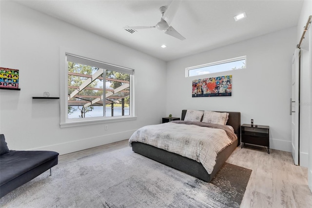 5500 W Lake Butler Rd, Windermere, FL 34786 - bedroom with multiple windows, wood finished floors, baseboards, ceiling fan, and recessed lighting