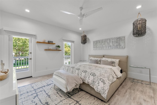 5500 W Lake Butler Rd, Windermere, FL 34786 - bedroom with access to outside, wood finished floors, multiple windows, and baseboards
