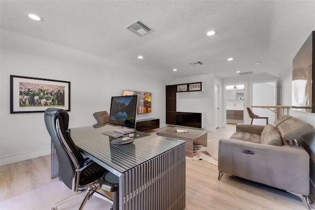 5500 W Lake Butler Rd, Windermere, FL 34786 - office featuring light wood-type flooring, a textured ceiling, recessed lighting, and baseboards