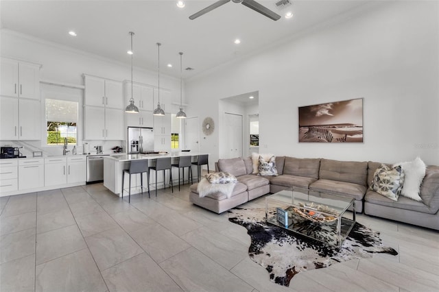 5500 W Lake Butler Rd, Windermere, FL 34786 - living area with ornamental molding, a ceiling fan, and recessed lighting