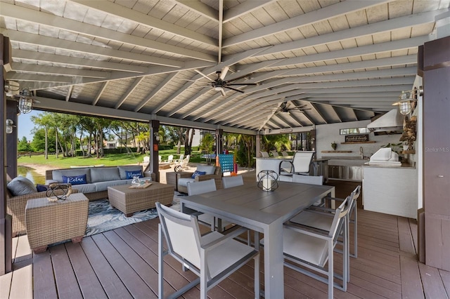 5500 W Lake Butler Rd, Windermere, FL 34786 - wooden deck featuring an outdoor hangout area, an outdoor kitchen, and ceiling fan