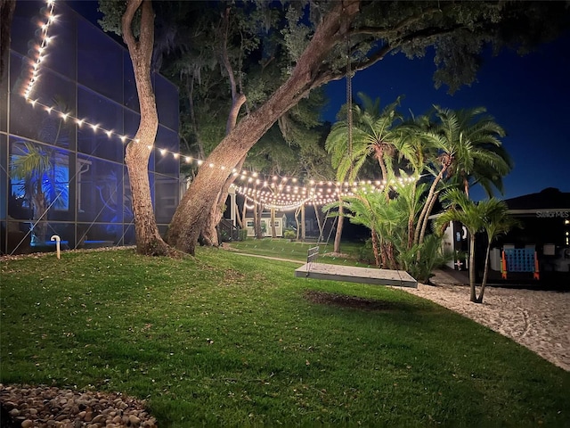 5500 W Lake Butler Rd, Windermere, FL 34786 - yard at night featuring a lawn