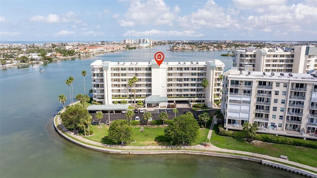 aerial view of apartment complex and a nearby body of water