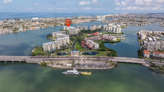 view of urban area with a large body of water and a notable bridge