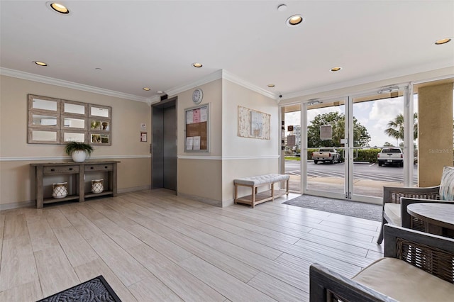 building lobby with ornamental molding and recessed lighting