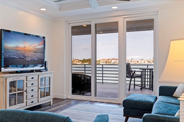 7922 Sailboat Key Blvd S Unit 105, South Pasadena, FL 33707 - living area with wood finished floors, crown molding, and recessed lighting