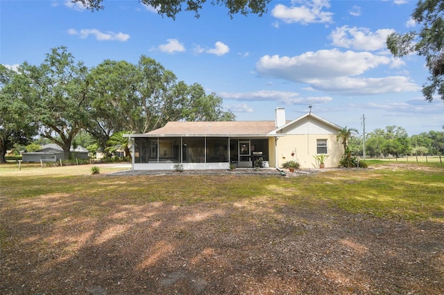 1202 Williams Rd, Plant City, FL 33565 - back of house with a sunroom, a yard, and a chimney