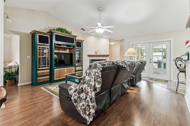 1202 Williams Rd, Plant City, FL 33565 - living room with a ceiling fan, wood finished floors, french doors, baseboards, and lofted ceiling