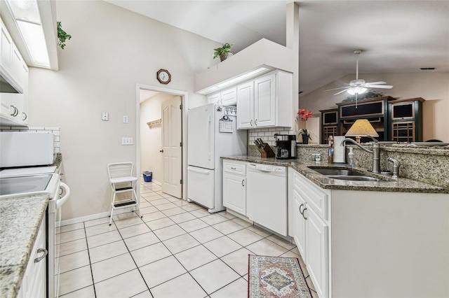 1202 Williams Rd, Plant City, FL 33565 - kitchen with white appliances, vaulted ceiling, a sink, decorative backsplash, and ceiling fan