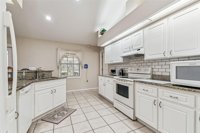 1202 Williams Rd, Plant City, FL 33565 - kitchen featuring white appliances, under cabinet range hood, a sink, light tile patterned floors, and white cabinetry