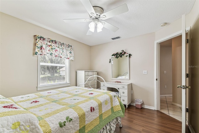 1202 Williams Rd, Plant City, FL 33565 - bedroom featuring dark wood-style floors, ceiling fan, and baseboards