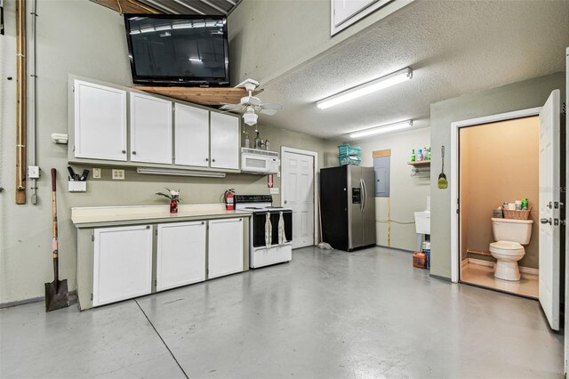 1202 Williams Rd, Plant City, FL 33565 - garage featuring stainless steel refrigerator with ice dispenser, electric panel, and a ceiling fan