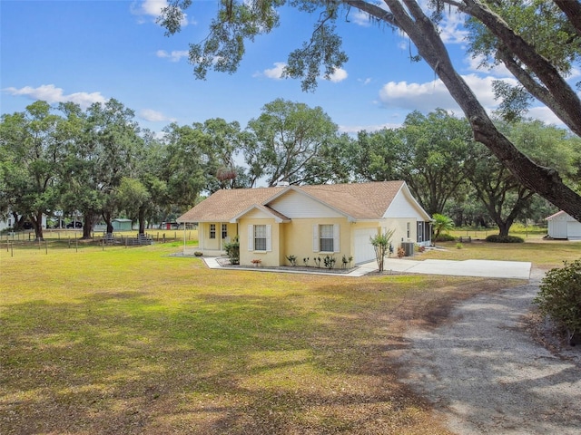 1202 Williams Rd, Plant City, FL 33565 - view of front facade with driveway, an attached garage, and central AC unit