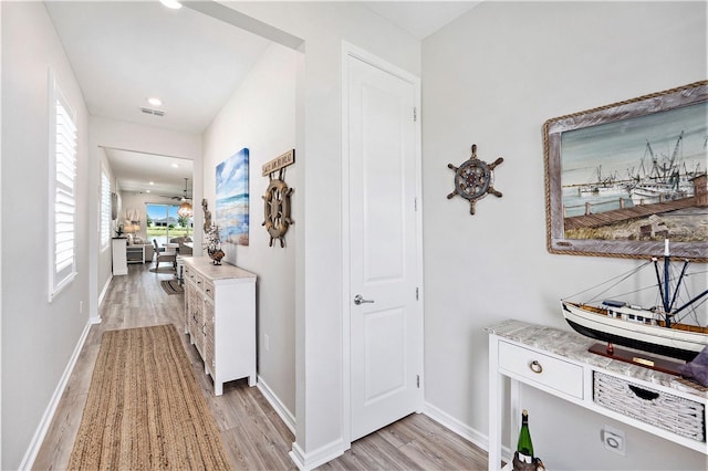 10418 Spring Tide Way, Parrish, FL 34219 - corridor with light wood finished floors, baseboards, and recessed lighting