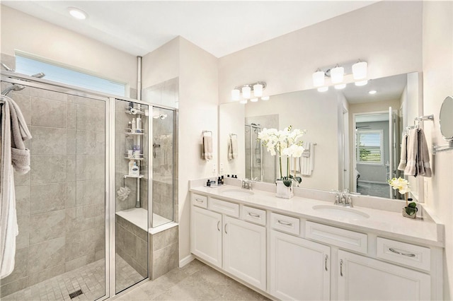 10418 Spring Tide Way, Parrish, FL 34219 - bathroom featuring a shower stall, double vanity, and tile patterned floors
