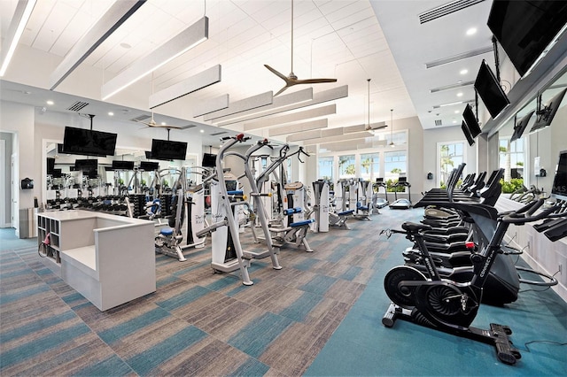 10418 Spring Tide Way, Parrish, FL 34219 - gym featuring carpet floors, ceiling fan, and plenty of natural light