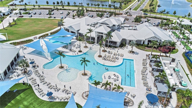 10418 Spring Tide Way, Parrish, FL 34219 - drone / aerial view of a pool and a large body of water