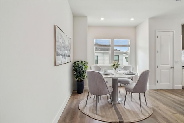 7232 Sutton Ln, Sarasota, FL 34240 - dining area featuring baseboards and light wood-style flooring