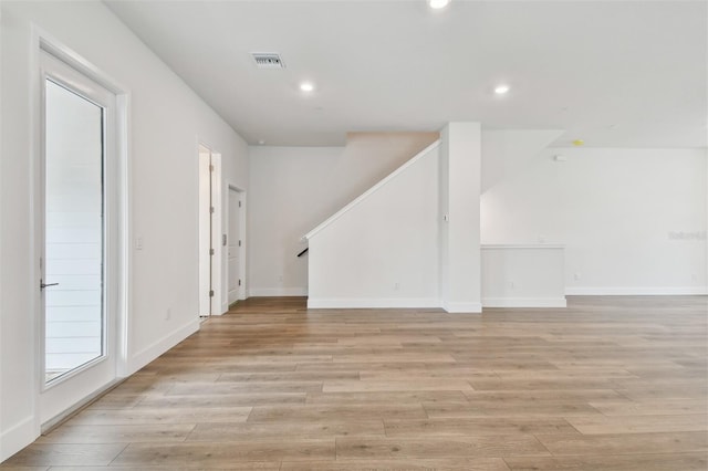 7232 Sutton Ln, Sarasota, FL 34240 - unfurnished room with recessed lighting, light wood-style flooring, stairway, and baseboards
