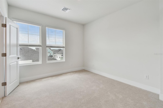 7232 Sutton Ln, Sarasota, FL 34240 - carpeted empty room featuring baseboards