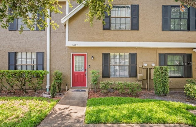 16504 Lake Brigadoon Cir, Tampa, FL 33618 - townhome / multi-family property featuring stucco siding