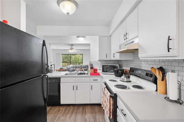 16504 Lake Brigadoon Cir, Tampa, FL 33618 - kitchen featuring black appliances, under cabinet range hood, a sink, ceiling fan, and light countertops