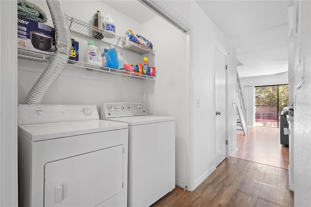 16504 Lake Brigadoon Cir, Tampa, FL 33618 - washroom with washing machine and clothes dryer, wood finished floors, and baseboards