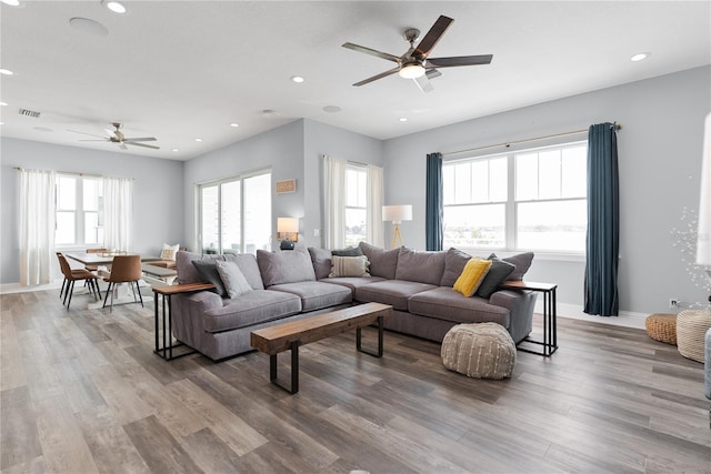 living room with ceiling fan, wood finished floors, recessed lighting, and baseboards