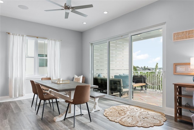 dining area with wood finished floors, a ceiling fan, recessed lighting, and baseboards