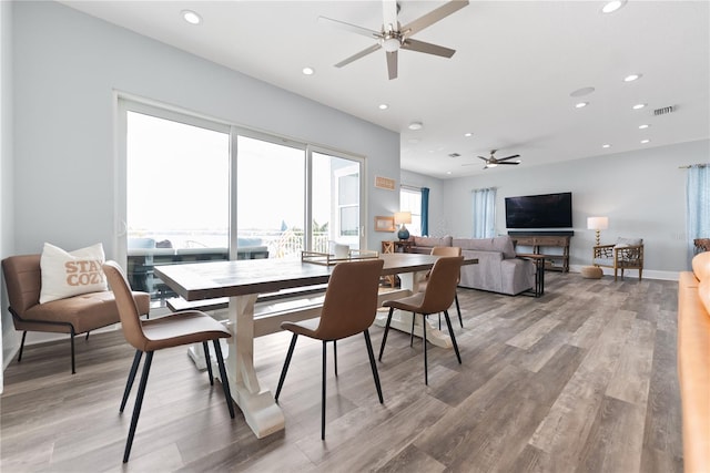dining room featuring ceiling fan, recessed lighting, light wood-style flooring, and baseboards