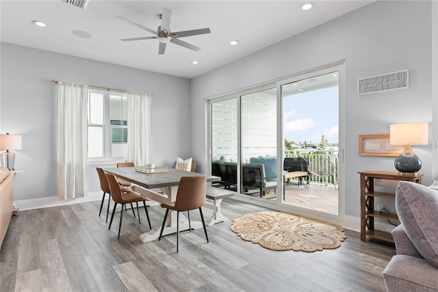 dining area featuring wood finished floors, a ceiling fan, plenty of natural light, and recessed lighting