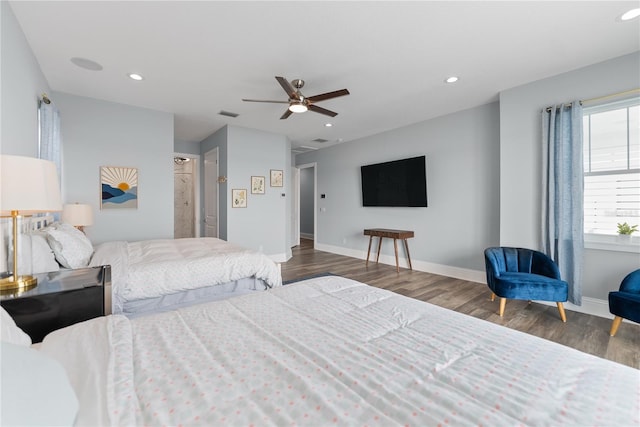 bedroom with wood finished floors, recessed lighting, baseboards, and a ceiling fan