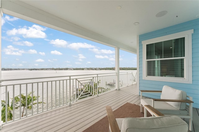 wooden terrace with a water view