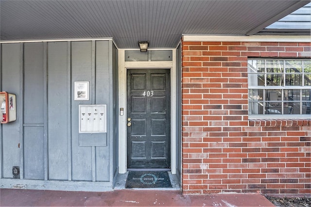 200 Country Club Dr Unit 403, Largo, FL 33771 - view of exterior entry featuring brick siding