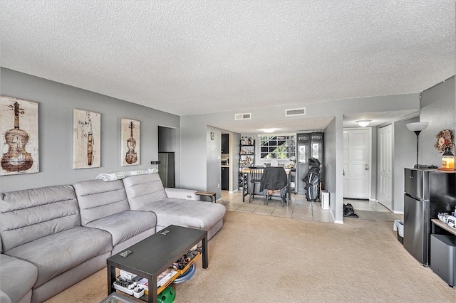 200 Country Club Dr Unit 403, Largo, FL 33771 - living area featuring carpet, a textured ceiling, tile patterned floors, and baseboards