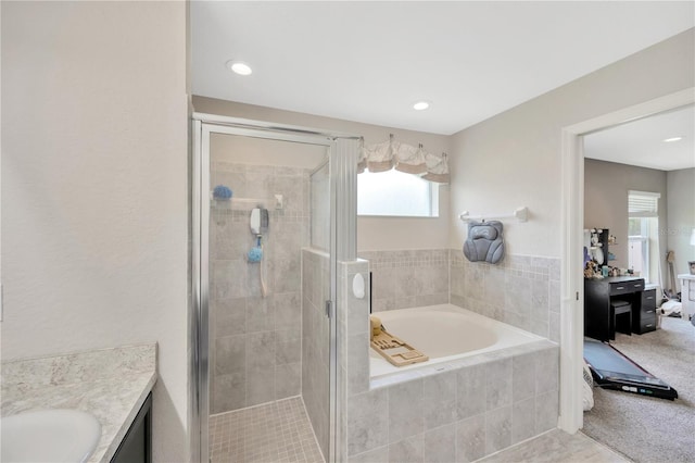 305 St Georges Cir, Eagle Lake, FL 33839 - ensuite bathroom with a bath, vanity, a stall shower, and tile patterned flooring