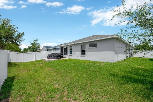 305 St Georges Cir, Eagle Lake, FL 33839 - rear view of house with stucco siding