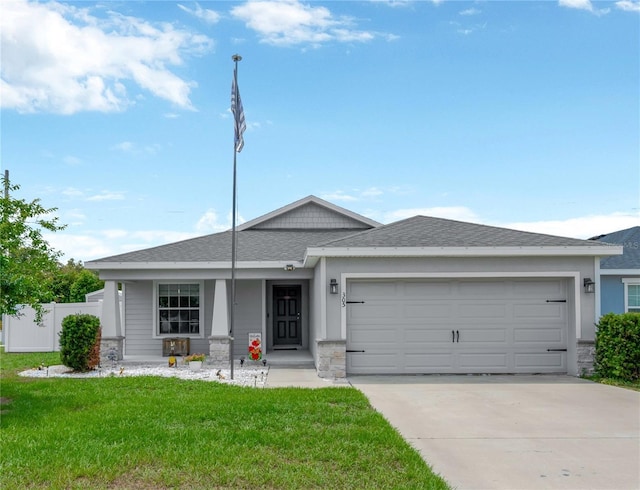 305 St Georges Cir, Eagle Lake, FL 33839 - ranch-style home featuring driveway, an attached garage, stone siding, covered porch, and roof with shingles
