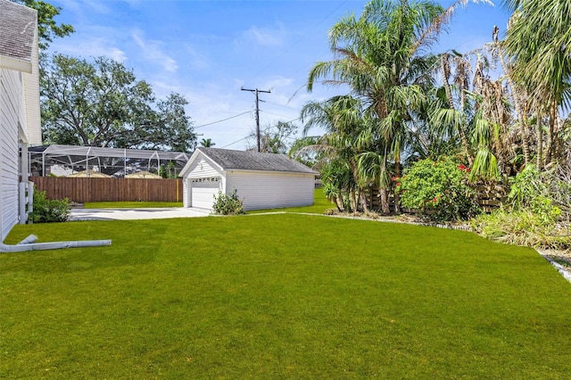 308 Chauncey Ave, Bradenton, FL 34208 - view of yard featuring an outdoor structure, a garage, and fence