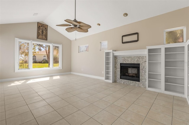 308 Chauncey Ave, Bradenton, FL 34208 - unfurnished living room featuring built in shelves, a ceiling fan, light tile patterned floors, baseboards, and a tiled fireplace