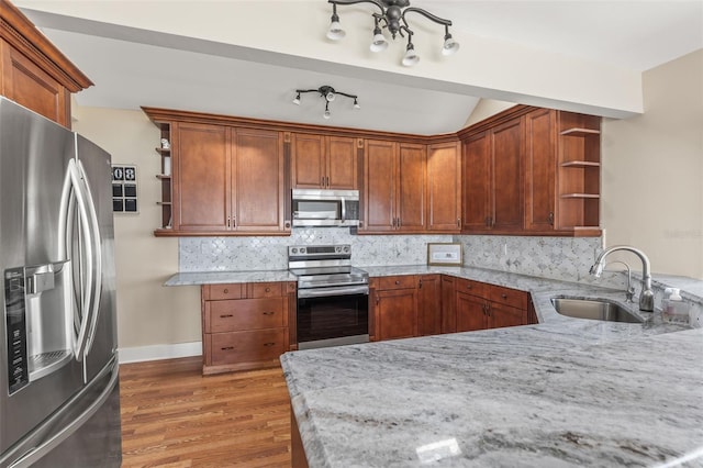 308 Chauncey Ave, Bradenton, FL 34208 - kitchen featuring a sink, open shelves, wood finished floors, stainless steel appliances, and tasteful backsplash
