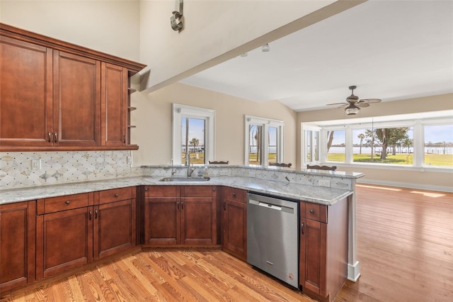 308 Chauncey Ave, Bradenton, FL 34208 - kitchen with a peninsula, light wood-style flooring, a sink, and stainless steel dishwasher