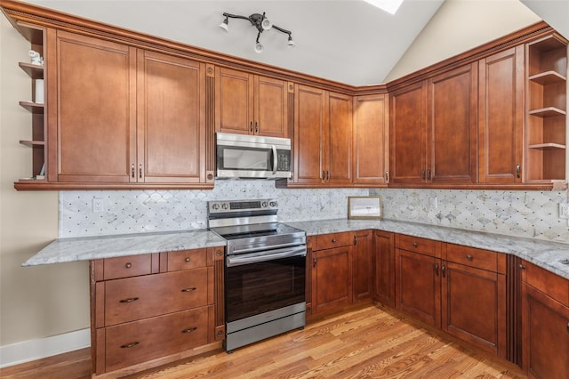 308 Chauncey Ave, Bradenton, FL 34208 - kitchen with open shelves, light wood-style floors, stainless steel appliances, and decorative backsplash
